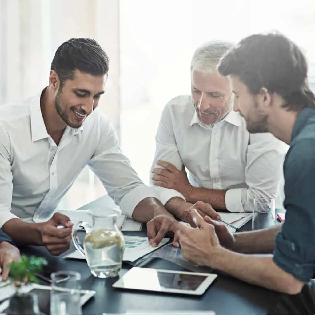 Shot of a group of businessmen having a meeting around a table in an office